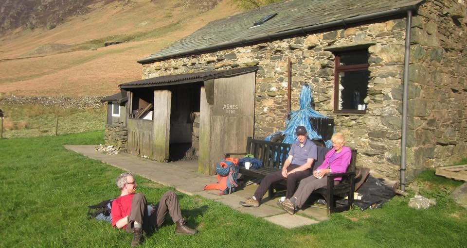 Chatting outside Carlisle Mountaineering Club Hut after a day climbing in Newlands Valley